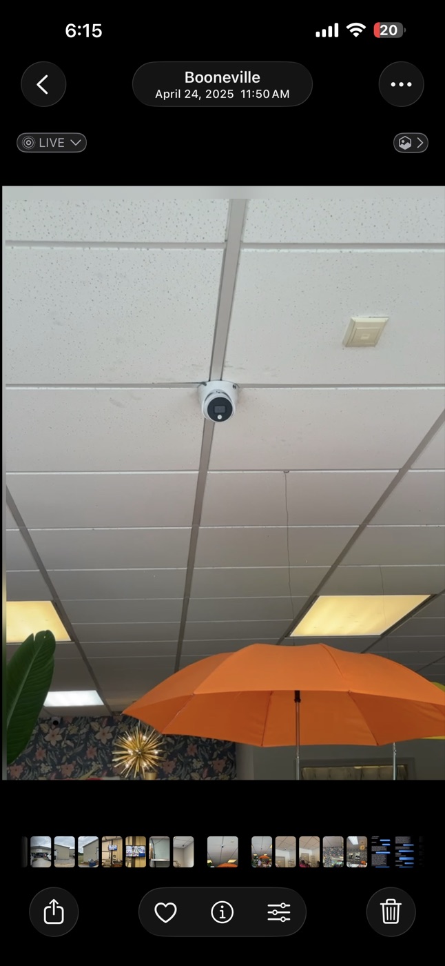 Indoor security camera installed in a retail space ceiling